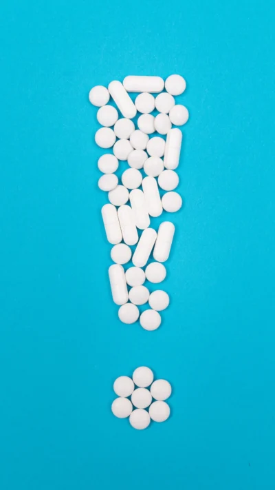 Medicine arranged in an exclamation mark concept image for medication assisted treatment in New Jersey