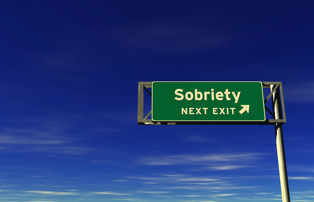 sign that reads sobriety next left