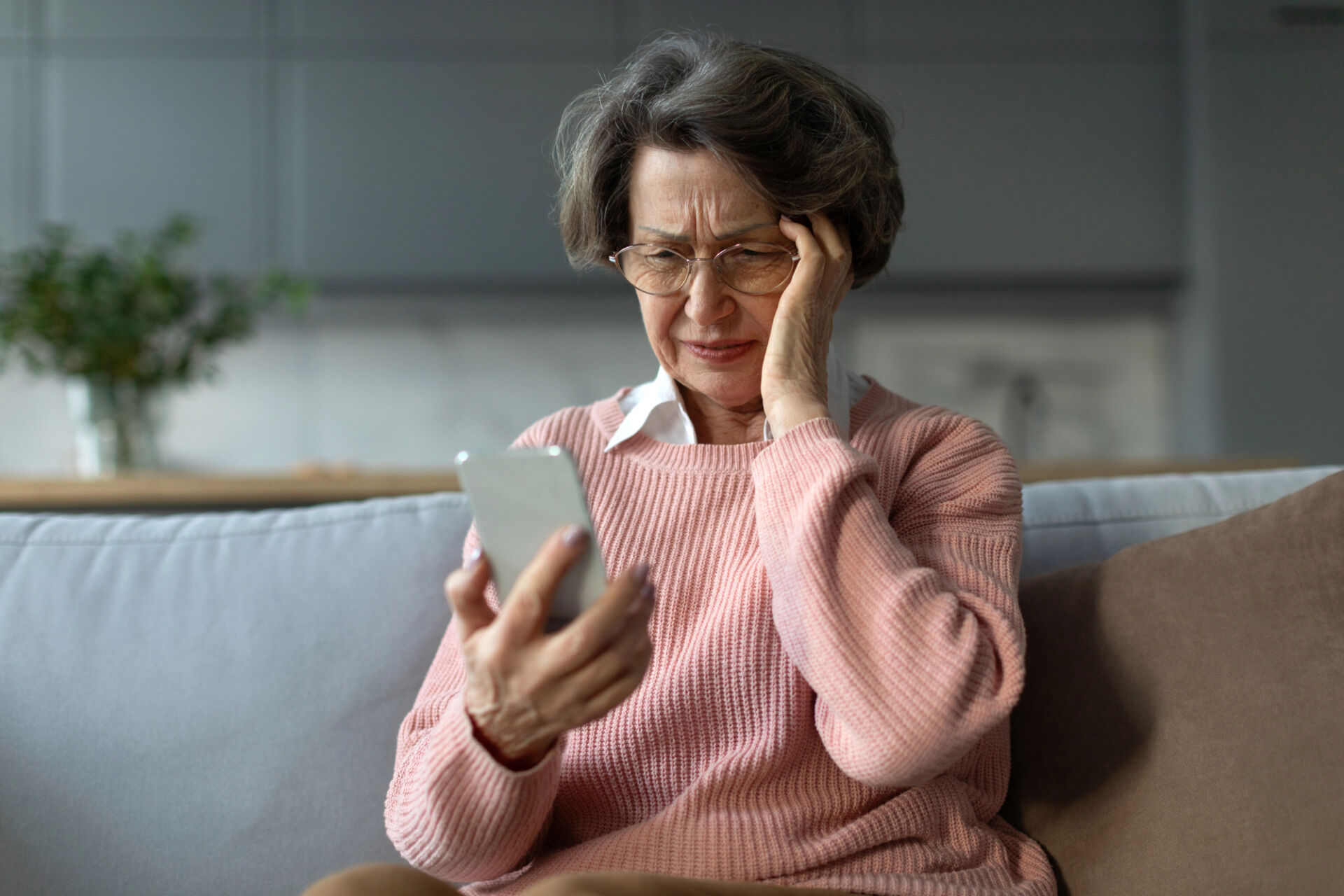 gambling addiction and women is a big problem like for this older woman playing slots on her phone